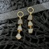 dangler earrings with gold finish and 3 ammolite stones by silly owl