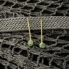 minimalist stud gold earring on a thin line with semi precious green emerald stone earring by silly owl