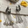 peacock top hanging chain earrings with om silver look alike oxidised finish earrings by silly owl