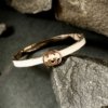 A gucci symbol cuff kada bracelet bangle with a rose gold finish by silly owl