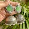 Alankara oxidised Jhumka earrings with a green monalisa stone and Moti hanging by silly owl