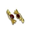 Golden leaf on top with bell earrings and a maroon color stone by silly owl