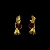 Golden leaf on top with bell earrings and a maroon color stone by silly owl