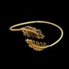 Minimal feather adjustable cuff Kada with gold electroplating finish by silly owl