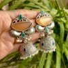 Oxidised Jhumka earrings with an orange big stone and smaller green stones by silly owl 1