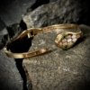 a dainty hinge clasp serpent face rose gold finish cuff kada bangle by silly owl