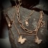 dainty chich rose gold shimmer and plain finish hanging butterfly charm 2 chain bracelet by silly owl