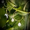 dainty elegant minimalistic hoop earrings made of brass light weight with a gold finish and mother of pearl drop hangings by silly owl