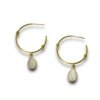 dainty elegant minimalistic hoop earrings made of brass light weight with a gold finish and mother of pearl drop hangings by silly owl