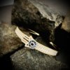 delicate mild gold finish bracelet with rectangular diamond stone setting and evil eye in a hamsa hand kada by silly owl