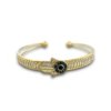 delicate mild gold finish bracelet with rectangular diamond stone setting and evil eye in a hamsa hand kada by silly owl