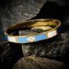 geometrical evil eye shades of blue cuff kada band bracelet with gold electroplating by silly owl