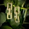 light weight rectangular trending modern chain link earrings made of fiber plastic in a gold finish by silly owl