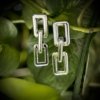 light weight rectangular trending modern chain link earrings made of fiber plastic in a silver finish by silly owl