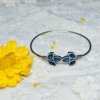 minimal design oxidised kada with 3 flower petals in blue stone and adjustable fit by silly owl