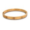 plain cartier band with a rose gold finish of screw nail heads by silly owl