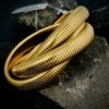 trending spring elasticated triple layer entangled gold statement bracelet by silly owl