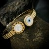 watch look alike evil eye adjustable cuff kada with mother of pearls and electroplating gold finish by silly owl