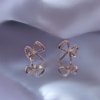 AD artificial diamond studded bow shaped western collection dainty earrings with a rose gold finish anti tranish water resitant jewllery with a silver 925 post elegance by silly owl