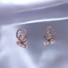 AD artificial diamond studded ora design 2 intersecting circles western collection dainty earrings with a rose gold finish anti tranish water resitant jewllery with a silver 925 post elegance by silly owl