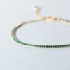 gold finish with ad artificial diamond having round 1.5mm green diamonds dainty thin elegant tennis bracelet anti tarnish water resistant jewelry by silly owl