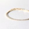 gold finish with ad artificial diamond having round 2mm diamonds elegant tennis bracelet anti tarnish water resistant jewelry by silly owl