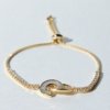 gold finish with ad artificial diamond having round diamonds and mother of pearls C channel logo design in the centre elegant adjustable tennis bracelet anti tarnish water resistant jewelry by silly owl (2)