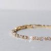 gold finish with ad artificial diamond with rectangular and square round shapes elegant tennis bracelet anti tarnish water resistant jewelry by silly owl