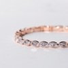 rose gold finish with ad artificial diamond having an oval shape elegant tennis bracelet anti tarnish water resistant jewelry by silly owl