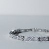 silver rhodium finish with ad artificial diamond leaf shaped diamonds with floral shape diamonds elegant tennis bracelet anti tarnish water resistant jewelry by silly owl