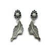 contemporary design oxidised earrings by silly owl with a floral top black stones and pearl and a hanging leaf design