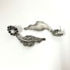 contemporary design oxidised earrings by silly owl with a floral top black stones and pearl and a hanging leaf design 2