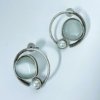 modern contemporary quirky oxidised earring design by silly owl with a white monalisa stone and pearl in a circular design 1