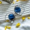 modern contemporary quirky oxidised earring design by silly owl with blue monalisa stones in a circular design