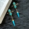 ocean blue crystal and turquoise gold polish dangler statement earrings gold quirky jewellery by silly owl