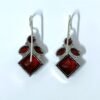 Elegant ruby red Monalisa stone hanging oxidised earrings with fish hook by silly owl