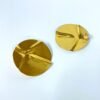 gold plated quirky circular statement earrings by silly owl jewellery with a wave folded fabric design(1)