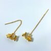 gold plated travel love scooter themed brass sui dhaga statement earrings by silly owl anti tanish jewellery(6)