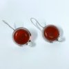 Light weight fish hook small dangler hanging earrings with a pearl and red monalisa stone by silly owl jewellery